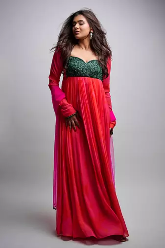 Pink red embroidered anarkali with green work and scallop embroidered net dupatta.