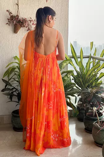 Yellow orange printed strappy ruched anarkali with matching scallop embroidered net dupatta.