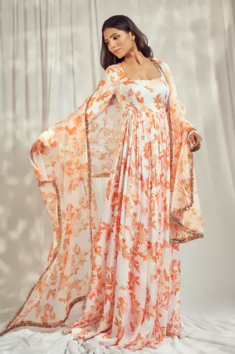 Burnt orange print self scallop anarkali with matching organza silk dupatta with gold trimming lace detailing.