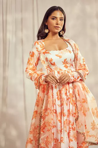 Burnt orange print self scallop anarkali with matching organza silk dupatta with gold trimming lace detailing.
