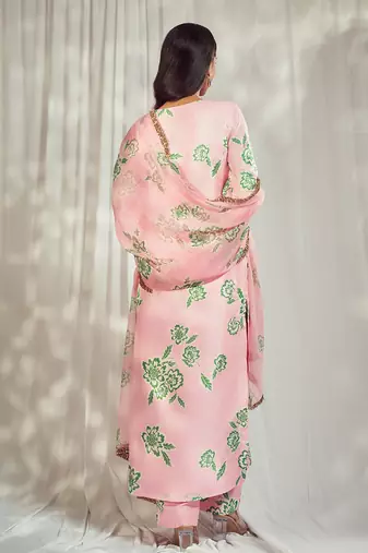 Baby pink print kurti set paired with matching bottom and star organdie dupatta with gold trimming lace detailing.