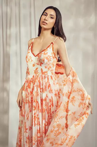Burnt orange print strappy anarkali with lace detailing paired with matching organza silk dupatta with lace detail.