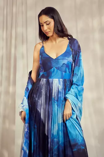 Blue print chiffon strappy anarkali with matching blue crepe dupatta with scallop embroidery border.