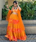 Yellow And orange embroidered blouse with matching tiered lehenga Set