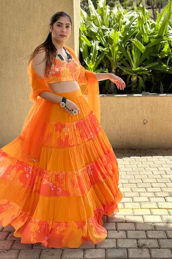 Yellow And orange embroidered blouse with matching tiered lehenga Set