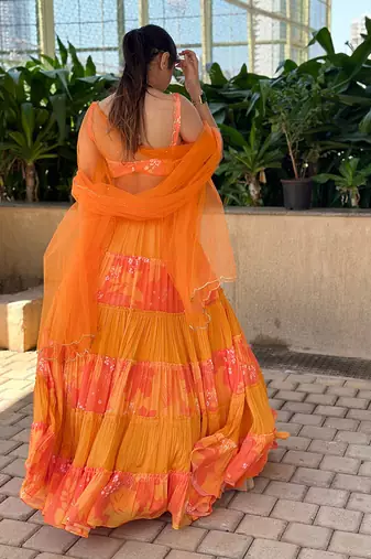 Yellow And orange embroidered blouse with matching tiered lehenga Set