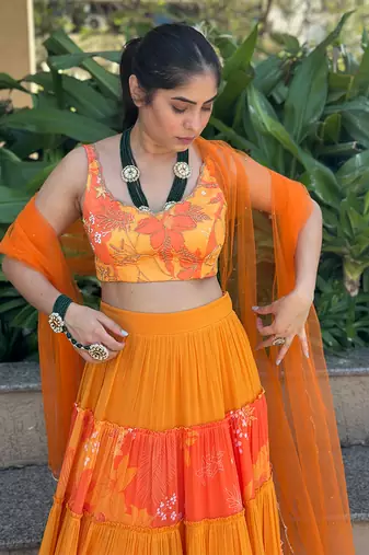 Yellow And orange embroidered blouse with matching tiered lehenga Set