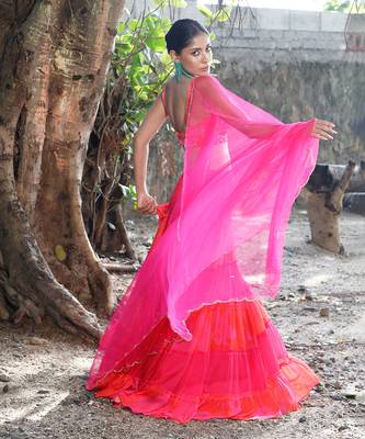 Pink and orange embroidered blouse with matching tiered lehenga 3