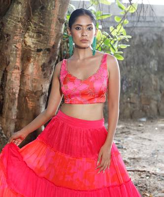 Pink and orange embroidered blouse with matching tiered lehenga 4