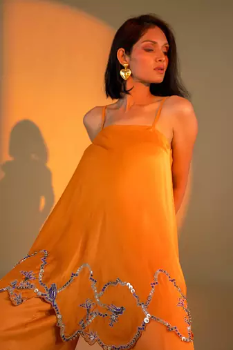 Rust orange sleeveless kurta set with embroidery & sharara