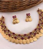 Gold-tone coin necklace set with emerald and ruby gemstones