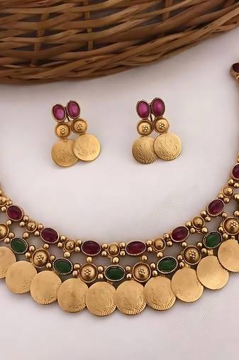 Gold-tone coin necklace set with emerald and ruby gemstones