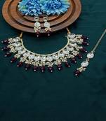 Elegant kundan choker set with ruby drops and matching earrings & tikka