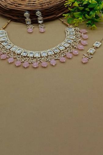 elegant kundan choker set with garnet drops and matching earrings & tikka
