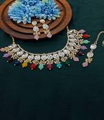 Elegant kundan choker set with ruby drops and matching earrings & tikka