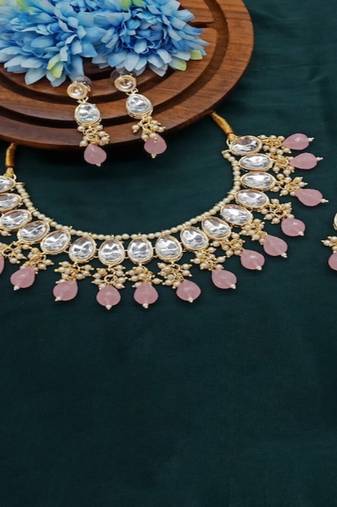 Elegant kundan choker set with ruby drops and matching earrings & tikka