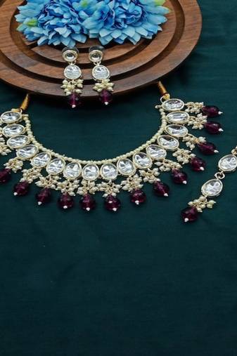 elegant kundan choker set with garnet drops and matching earrings & tikka