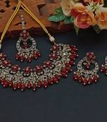 Elegant red and gold indian jewelry set - necklace, earrings, and maang tikka