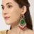 Elegant kundan-inspired chandelier earrings with red and green gemstones