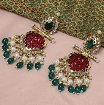 Elegant kundan-inspired chandelier earrings with red and green gemstones 2