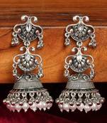 Vintage oxidized silver jhumka earrings with pearl and red bead accents
