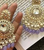 Exquisite kundan-inspired chandelier earrings with pearl and purple accents