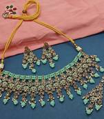 Mint green kundan choker necklace set with matching earrings and maang tikka