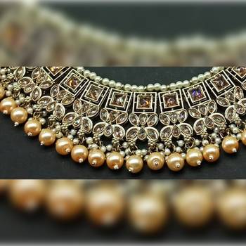 Exquisite gold tone and gold kundan jewelry set with pearl accents 2