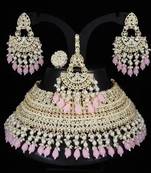 Opulent bridal kundan choker set with pink beads and matching earrings & maang tikka