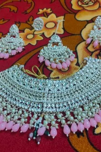 Opulent bridal kundan choker set with pink beads and matching earrings & maang tikka