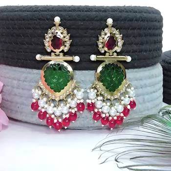Elegant kundan-inspired chandelier earrings with red and green gemstones 4