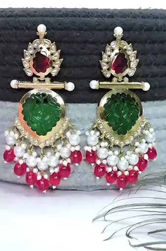 Elegant kundan-inspired chandelier earrings with red and green gemstones