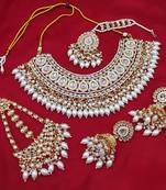 Luxurious white color kundan bridal necklace set with maang tikka and earrings
