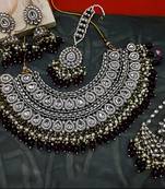 Exquisite kundan meena bridal necklace set with matching earrings and tikka