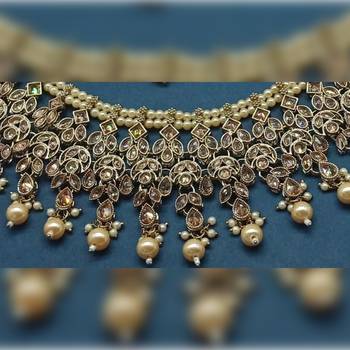 Antique gold kundan choker set with pearl drops and maang tikka 2
