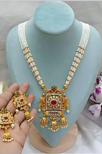 Elegant white pearl and gold kundan necklace set with ornate pendant