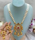 Elegant white pearl and gold kundan necklace set with ornate pendant