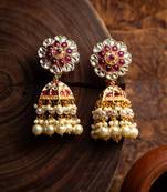 Gulab jhumkaas with a polki finish  with a touch of semi precious stones and pearl drops