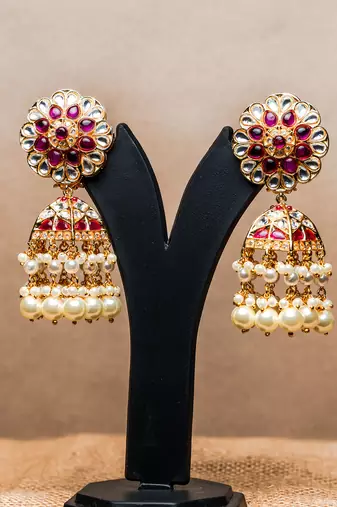 Gulab jhumkaas with a polki finish  with a touch of semi precious stones and pearl drops