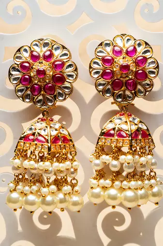 Gulab jhumkaas with a polki finish  with a touch of semi precious stones and pearl drops