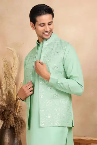 Cotton green kurta and trouser with embroidered green nehru jacket