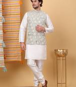 Silk blend cream kurta and churidar with embroidered light green nehru jacket