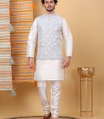 Silk blend cream kurta and churidar with embroidered light blue nehru jacket