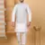 Silk blend cream kurta and churidar with embroidered light blue nehru jacket