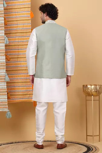 Silk blend cream kurta and churidar with embroidered light green nehru jacket
