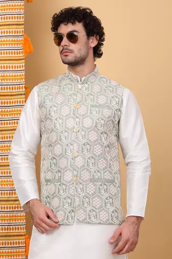 Silk blend cream kurta and churidar with embroidered light green nehru jacket