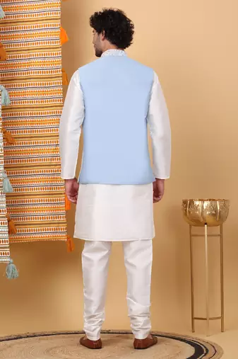 Silk blend cream kurta and churidar with embroidered light blue nehru jacket