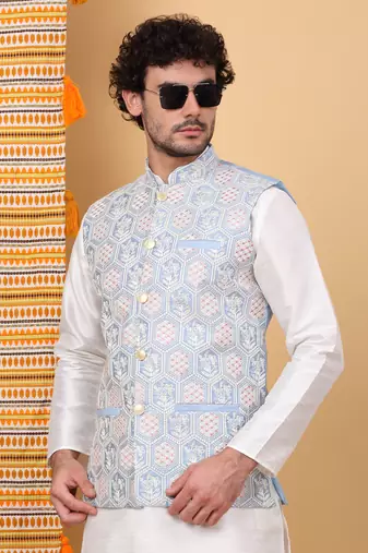 Silk blend cream kurta and churidar with embroidered light blue nehru jacket