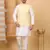 Silk blend cream kurta and churidar with embroidered lime yellow nehru jacket