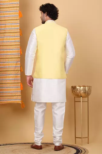 Silk blend cream kurta and churidar with embroidered lime yellow nehru jacket